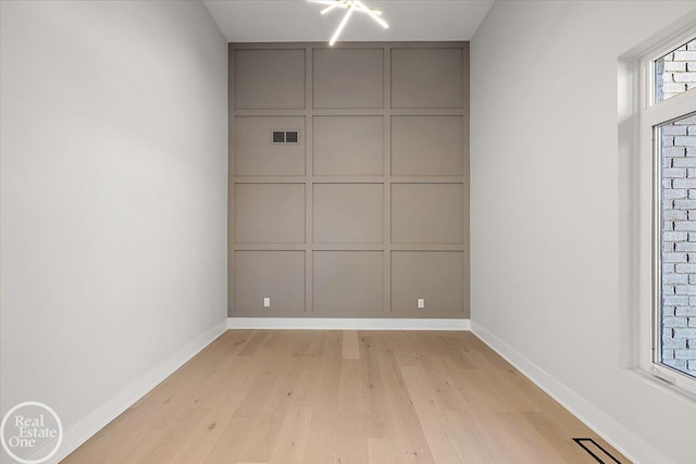 spare room with light hardwood / wood-style floors