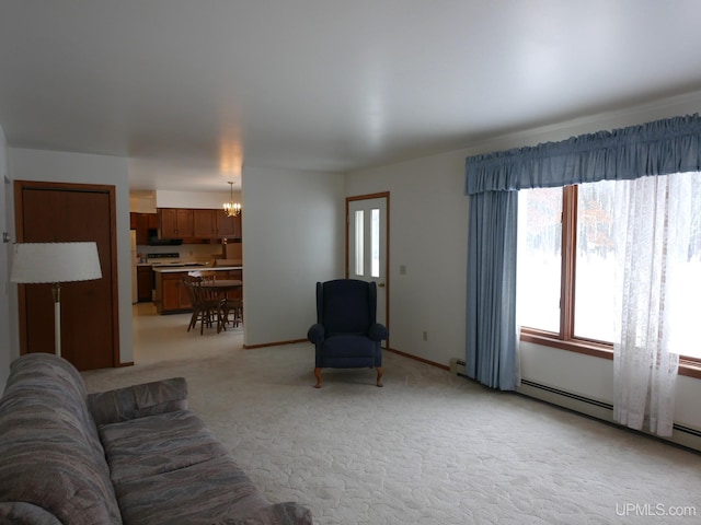 living room with light colored carpet, a baseboard heating unit, and an inviting chandelier