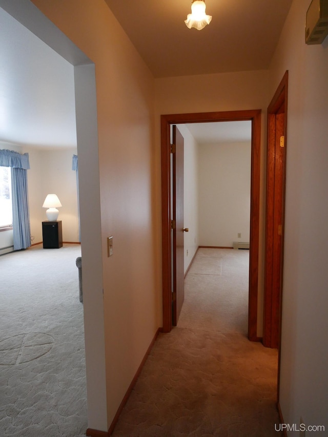 hall featuring light colored carpet