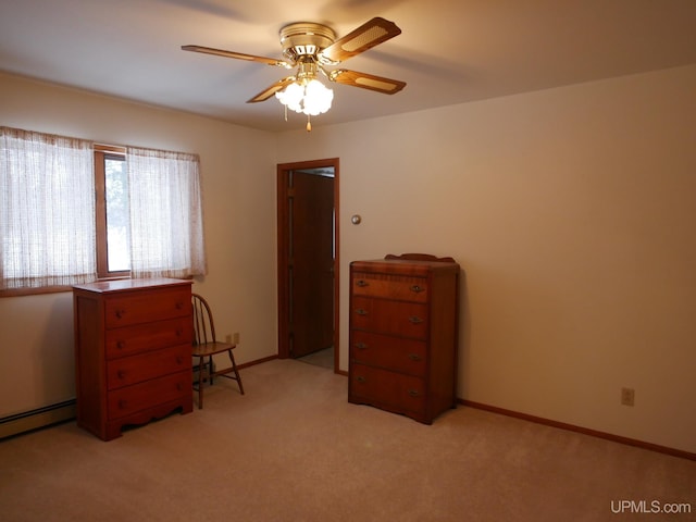 unfurnished bedroom featuring ceiling fan, baseboard heating, and light carpet