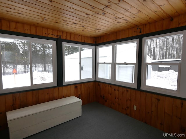 unfurnished sunroom with wooden ceiling