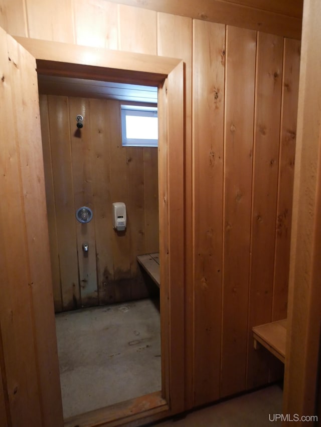 bathroom with wood walls