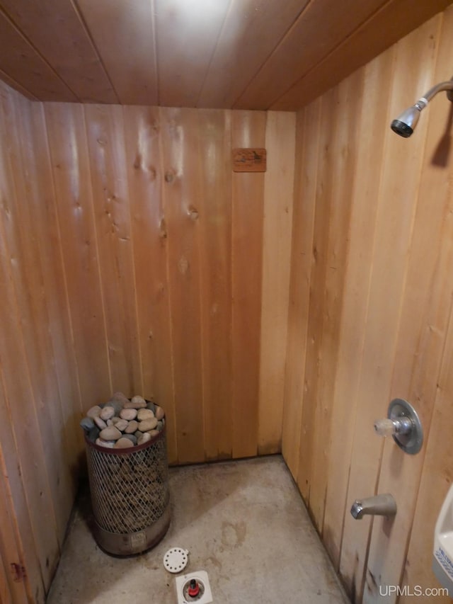 view of sauna featuring concrete floors