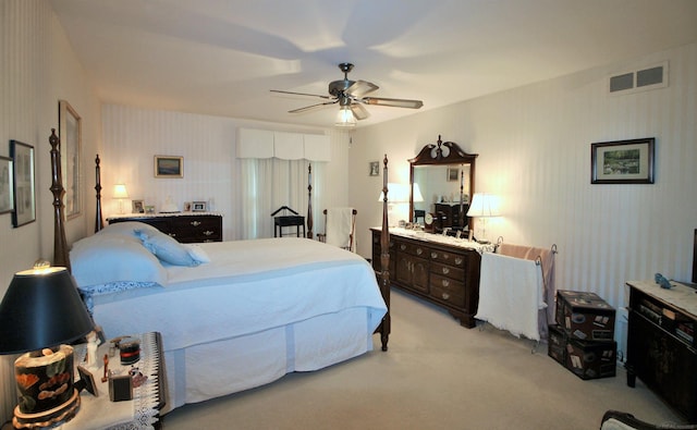 bedroom featuring ceiling fan and light carpet