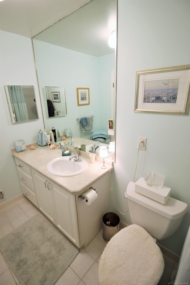 bathroom featuring tile patterned floors and vanity