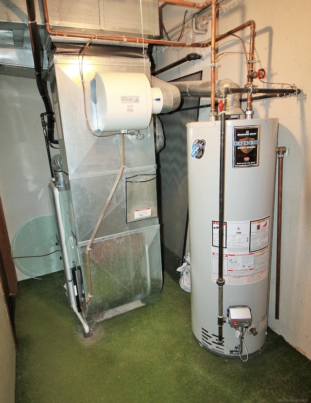 utility room featuring gas water heater and heating unit