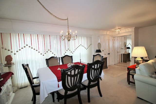 carpeted dining area featuring a chandelier