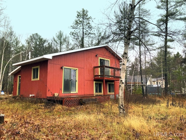 view of home's exterior featuring a balcony