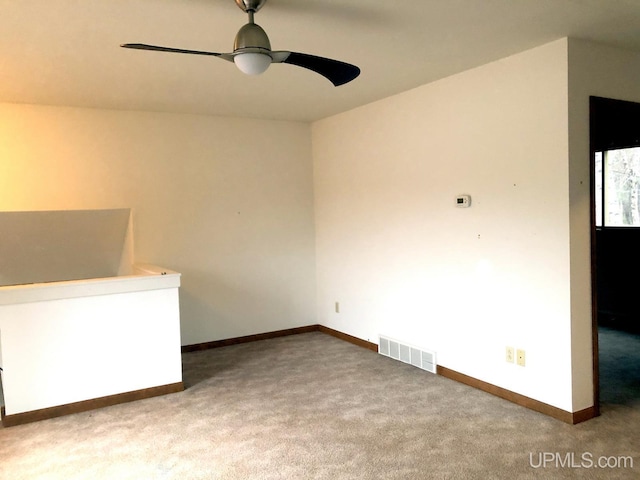 carpeted empty room with ceiling fan