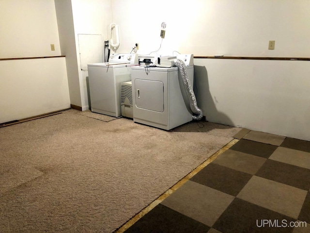 laundry room featuring carpet flooring and washing machine and dryer