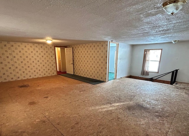 basement featuring a textured ceiling