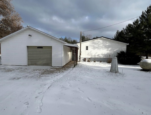 view of snow covered garage