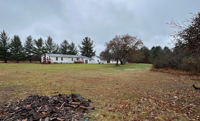 view of yard with an outdoor fire pit