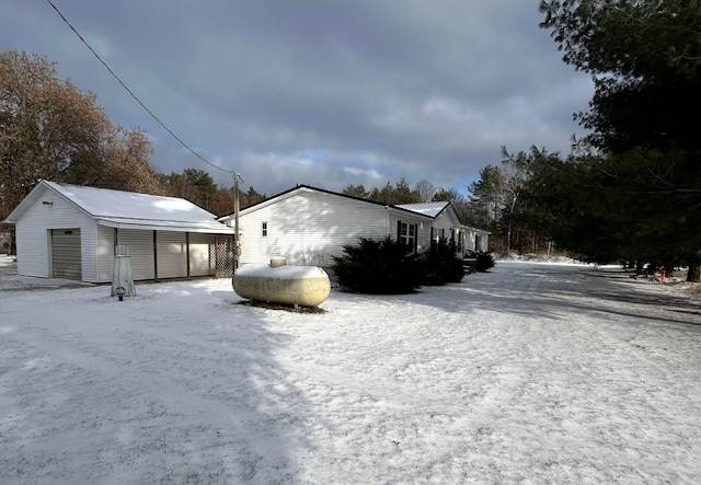 exterior space featuring an outbuilding and a garage