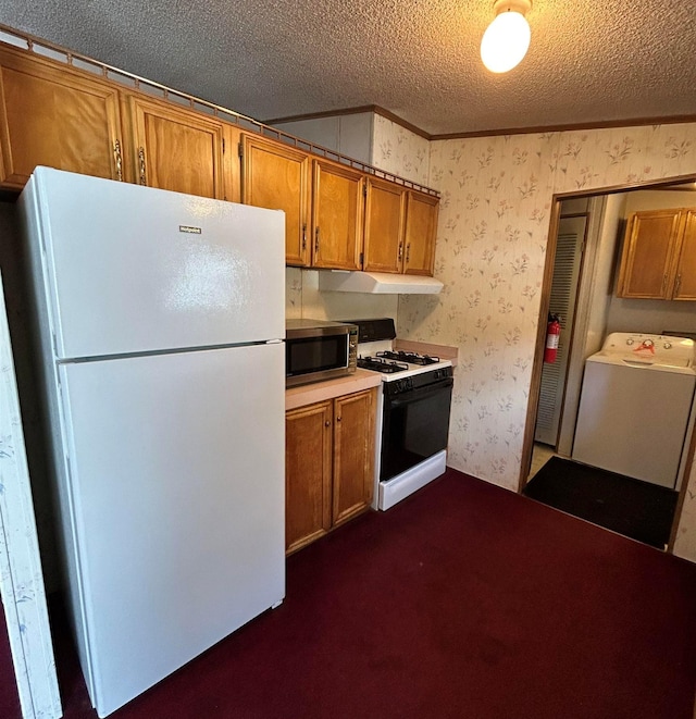 kitchen with washer / clothes dryer, a textured ceiling, white appliances, dark carpet, and ornamental molding