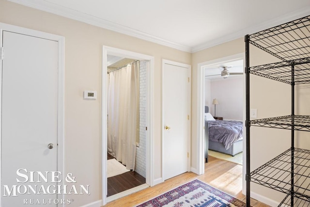 interior space with hardwood / wood-style flooring and ornamental molding