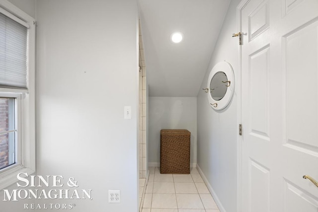 hallway with light tile patterned floors