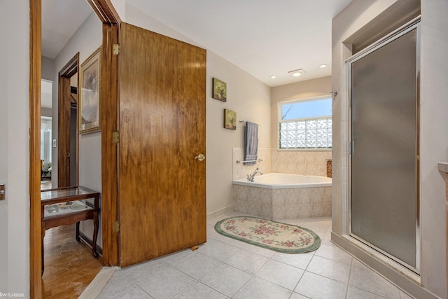 bathroom featuring plus walk in shower and tile patterned floors