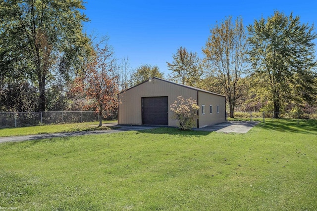 exterior space with an outbuilding and a garage