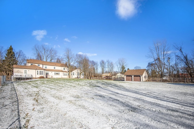 view of front of home with a garage and an outdoor structure