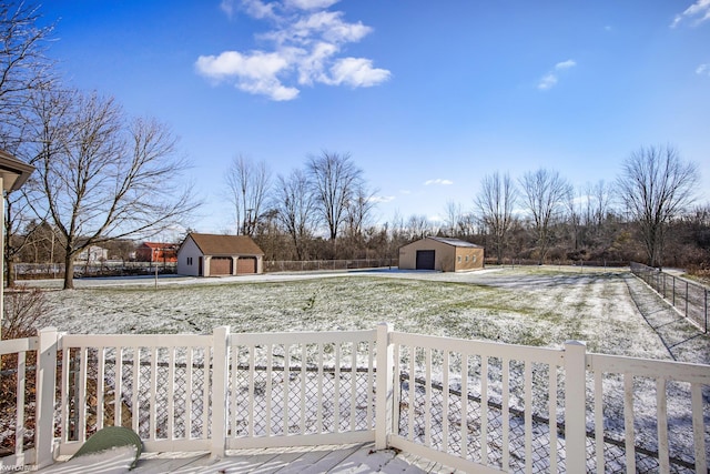 view of yard featuring a garage and an outdoor structure