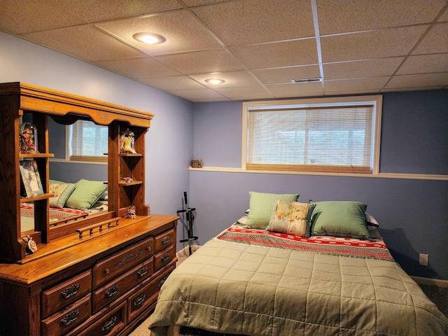 bedroom featuring a drop ceiling