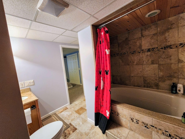 full bathroom with vanity, toilet, a drop ceiling, and shower / bathtub combination with curtain