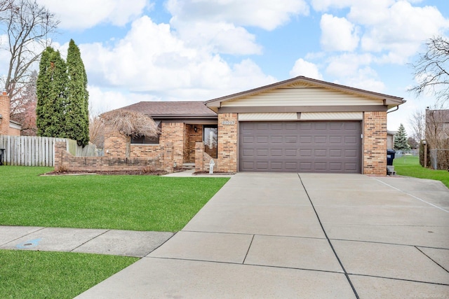 view of front facade featuring a garage and a front lawn