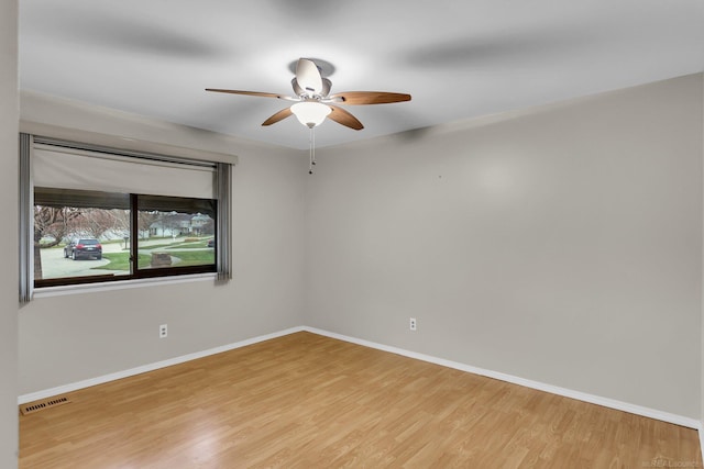 unfurnished room featuring light hardwood / wood-style flooring and ceiling fan