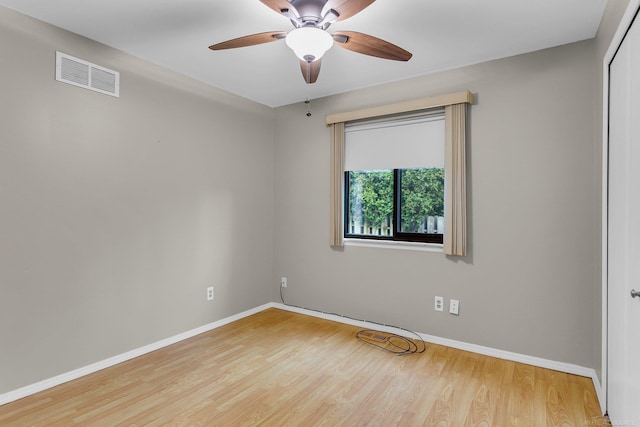 spare room featuring ceiling fan and light hardwood / wood-style flooring