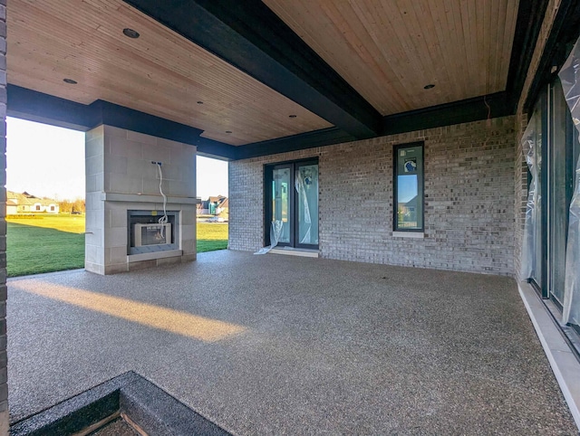 view of patio with a fireplace