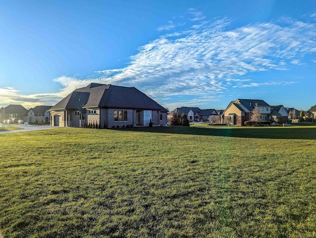 view of side of home featuring a lawn