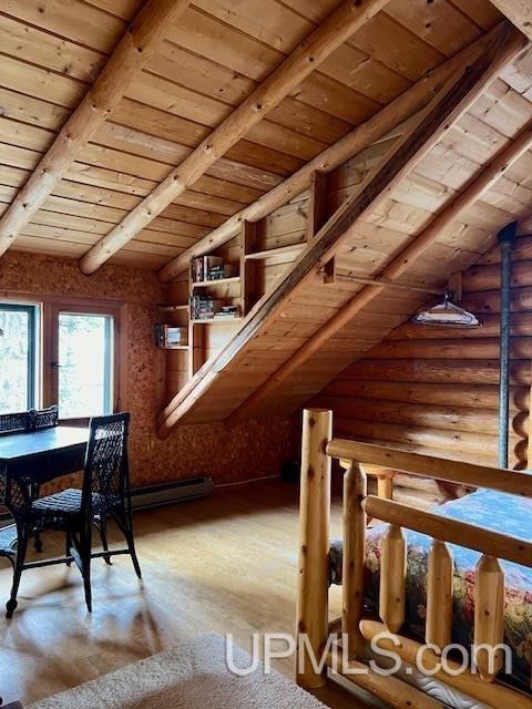 interior space featuring wood-type flooring, vaulted ceiling with beams, and wood ceiling