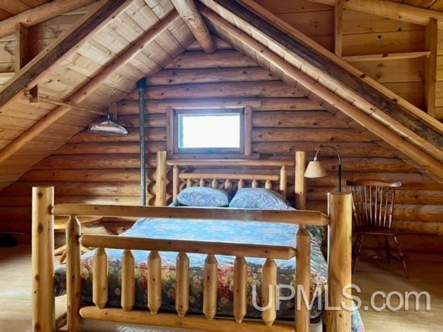 unfurnished bedroom with hardwood / wood-style floors, vaulted ceiling with beams, rustic walls, and wooden ceiling