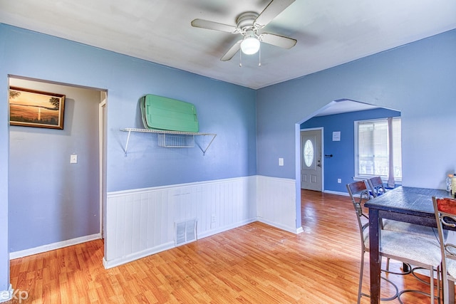 unfurnished dining area featuring ceiling fan and light hardwood / wood-style flooring