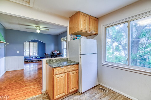 kitchen featuring white fridge, ceiling fan, and light hardwood / wood-style floors