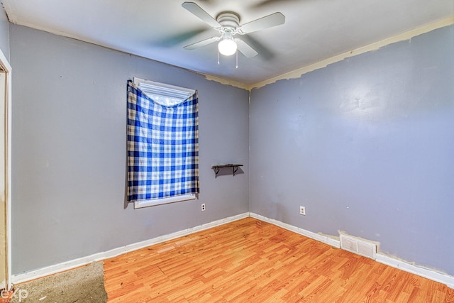 unfurnished room with light hardwood / wood-style flooring and ceiling fan