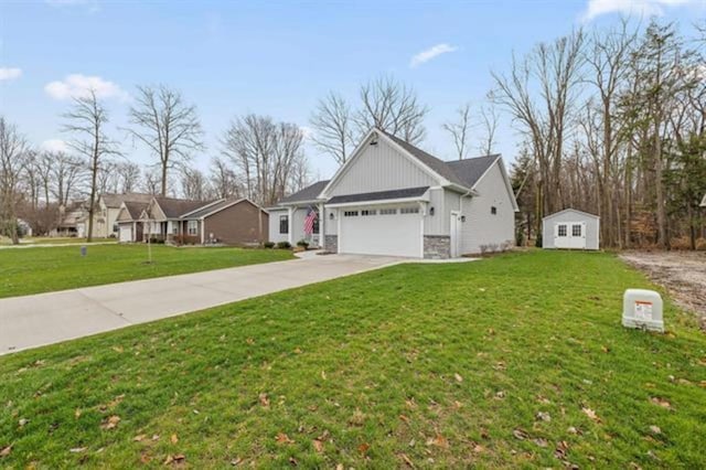 view of front of home with a garage, a storage shed, and a front lawn