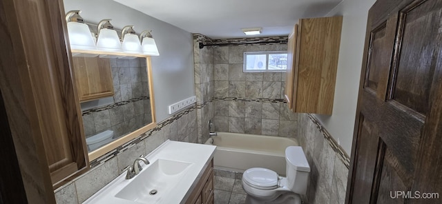 full bathroom with tile patterned floors, vanity, toilet, and tiled shower / bath