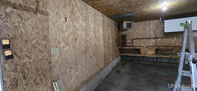 basement featuring a wall mounted AC