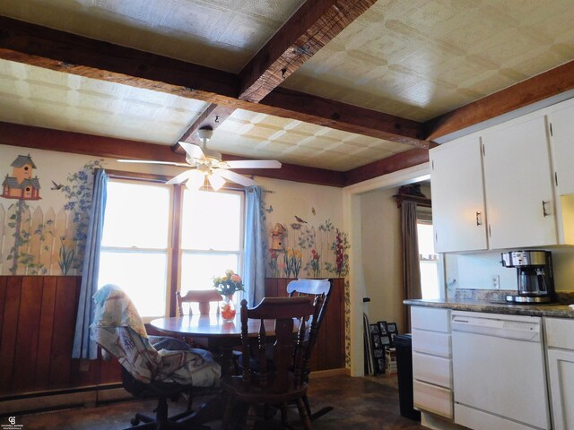 dining area featuring beamed ceiling and ceiling fan
