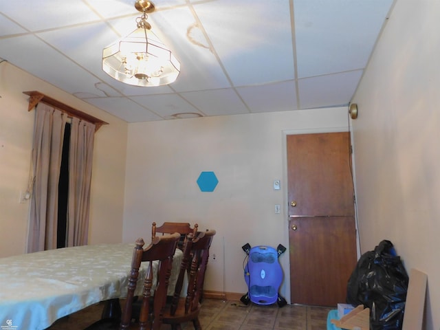 dining area with a drop ceiling
