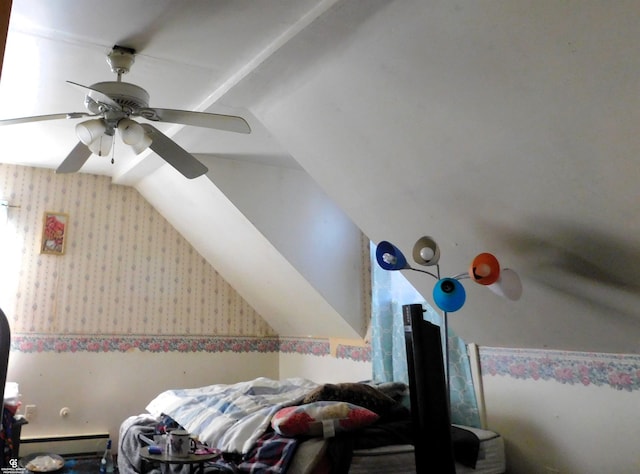 bedroom with baseboard heating, ceiling fan, and vaulted ceiling
