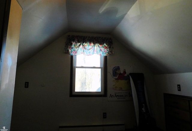 additional living space with baseboard heating and lofted ceiling