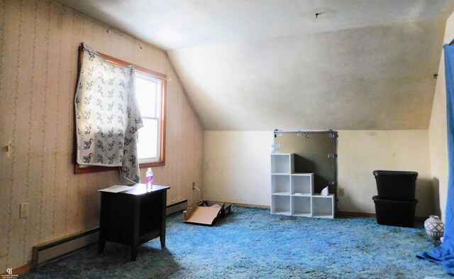 bonus room featuring carpet floors, baseboard heating, and vaulted ceiling