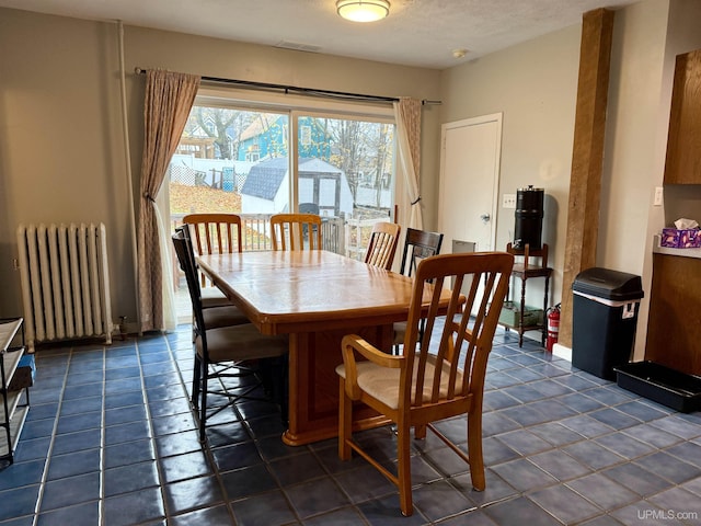 tiled dining area with radiator