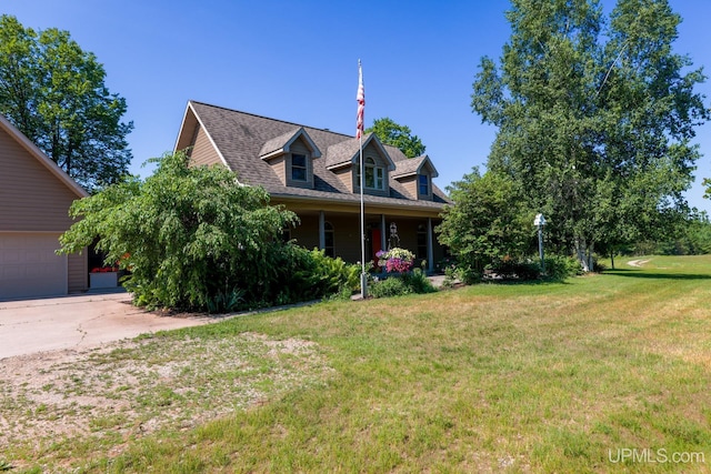 cape cod-style house with a garage and a front yard