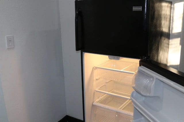 room details with black refrigerator