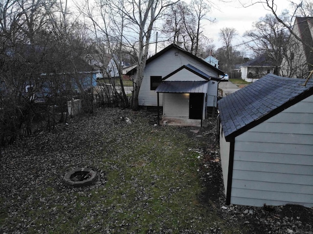 view of yard with an outdoor fire pit