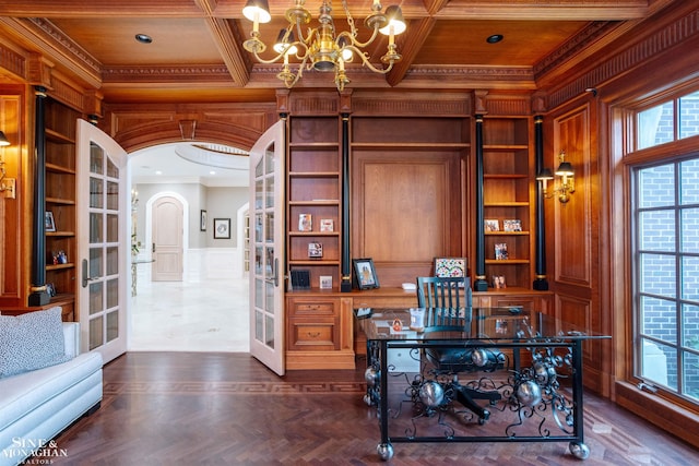 office space featuring french doors, ornamental molding, and coffered ceiling